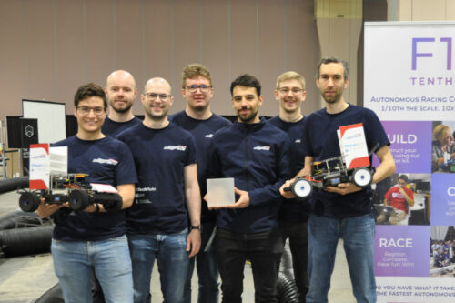 Students of TU Wien with cars and trophy