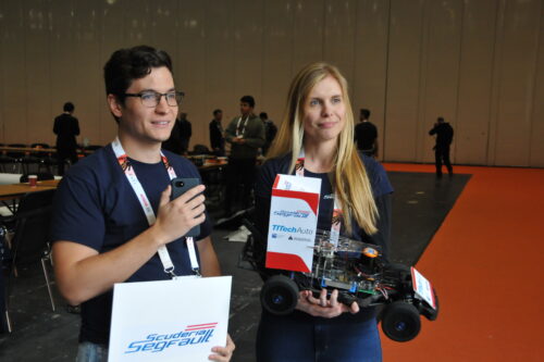 Students with race car during interview
