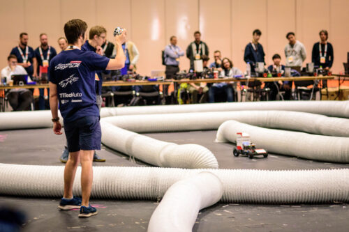 Team member of Scuderia Segfault with car during the race.