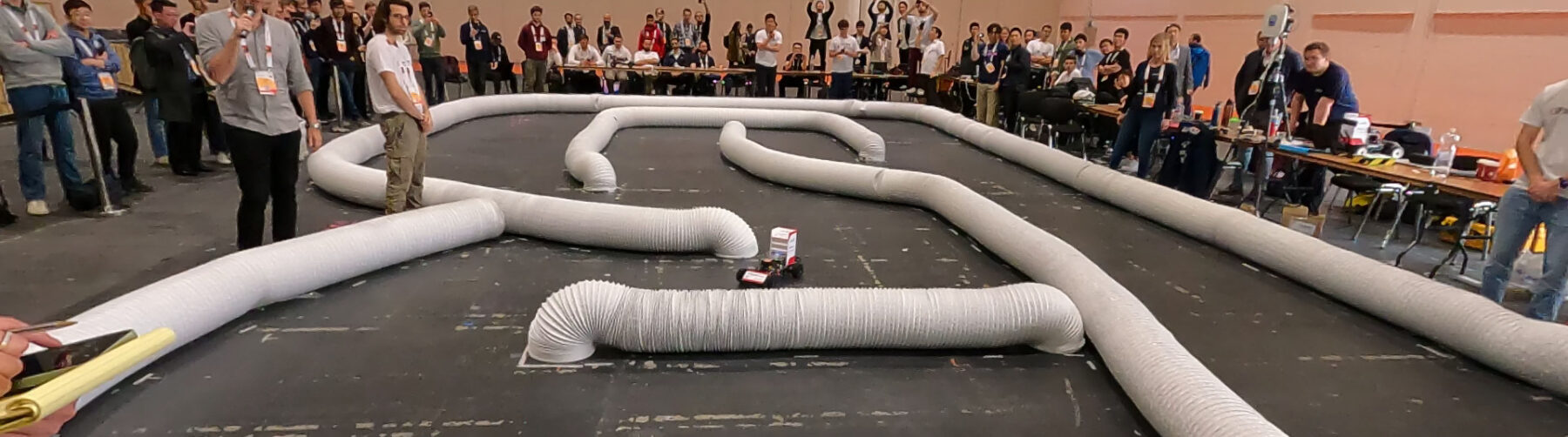 F1TENTH race at ICRA 2023 conference in London: track barriers and driving racing car