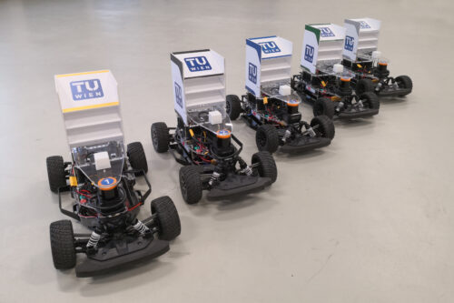 Five race car based on model Fiesta standing on the floor