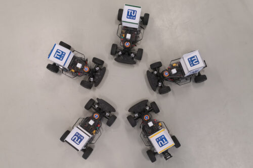 Five race car based on model Fiesta standing on the floor (picture from the top)