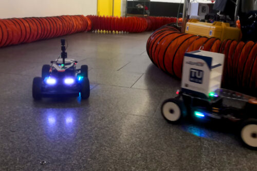 Two racing cars driving on the track.