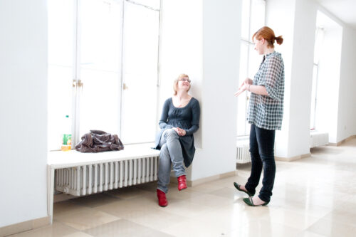 Two women in a corridor