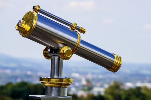 A telescope pointed at a landscape