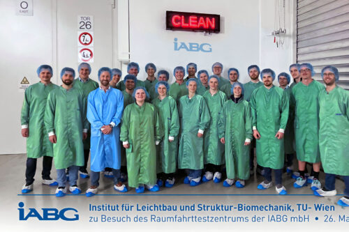 Group photo in the clean room of the space test centre of iABG mbH