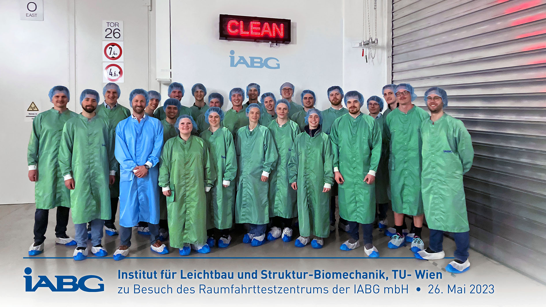 Group photo in the clean room of the space test centre of iABG mbH